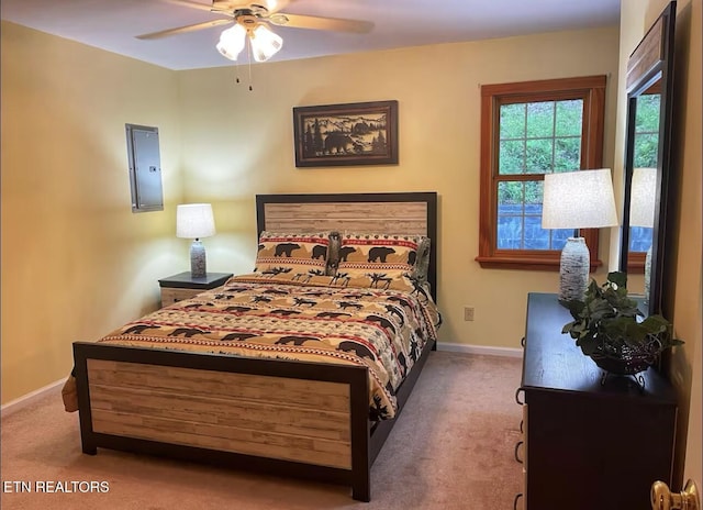 bedroom with ceiling fan and light carpet