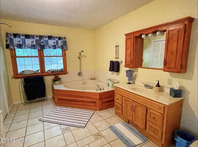 bathroom with tile patterned flooring, vanity, and a washtub