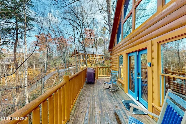 wooden deck with grilling area