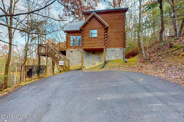 log home featuring a wooden deck