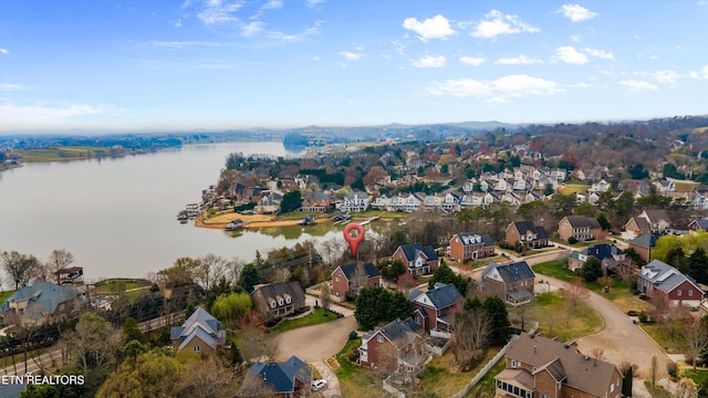 bird's eye view with a residential view and a water view