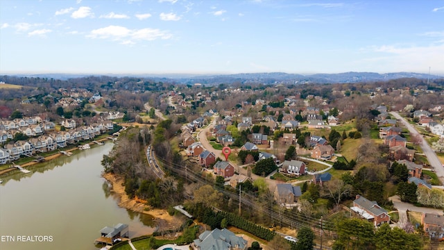 birds eye view of property featuring a residential view and a water view