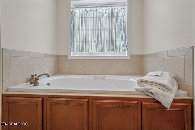 full bath with a garden tub