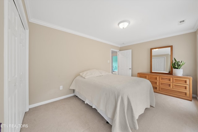 bedroom with visible vents, light colored carpet, a closet, and crown molding