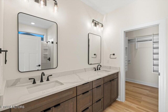 bathroom featuring hardwood / wood-style flooring and vanity