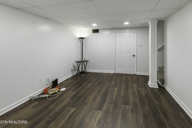 basement with dark hardwood / wood-style flooring