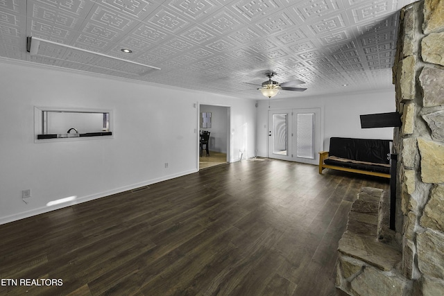 unfurnished living room featuring ceiling fan and hardwood / wood-style flooring