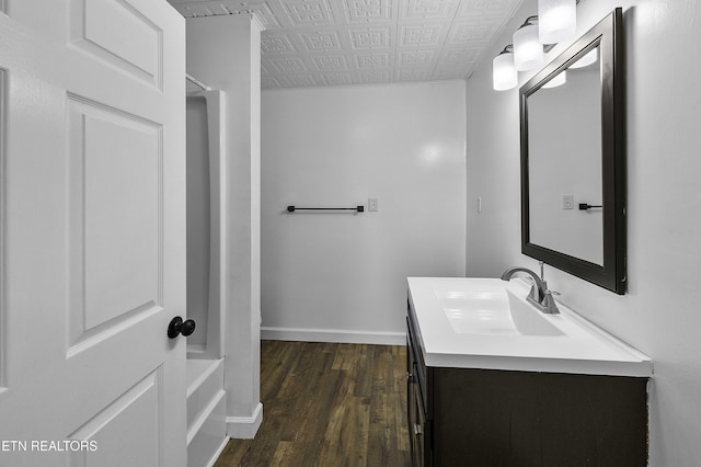 bathroom with vanity and hardwood / wood-style floors