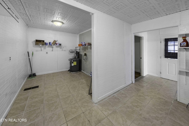 laundry room with water heater