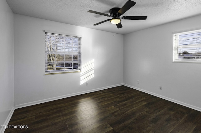 unfurnished room featuring a textured ceiling, ceiling fan, and dark hardwood / wood-style floors