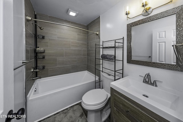 full bathroom with toilet, vanity, and tiled shower / bath combo