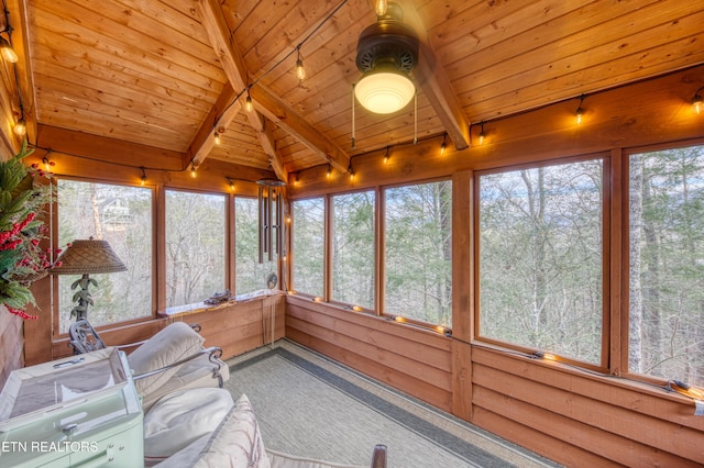 sunroom featuring vaulted ceiling with beams and wood ceiling