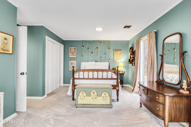 bedroom with light carpet, a closet, and crown molding