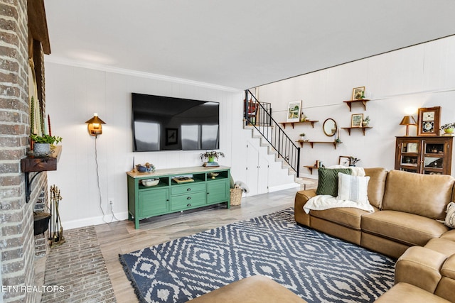 living room featuring hardwood / wood-style floors and ornamental molding