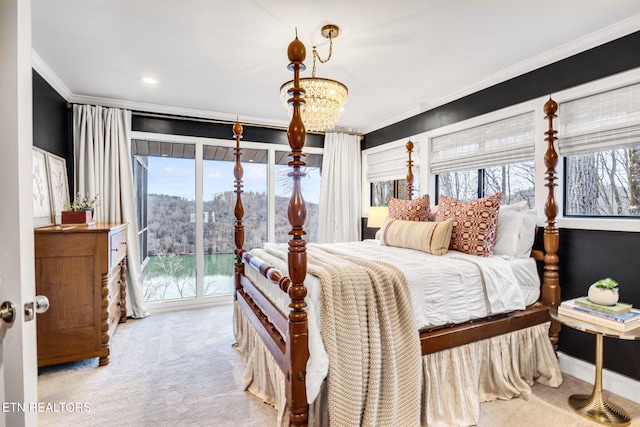 carpeted bedroom featuring an inviting chandelier, access to exterior, and crown molding