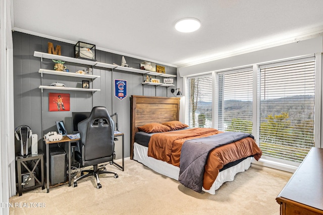 bedroom featuring crown molding and carpet flooring