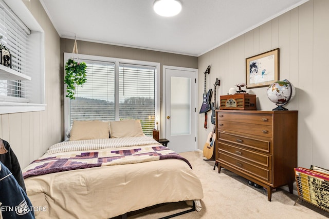 carpeted bedroom featuring ornamental molding