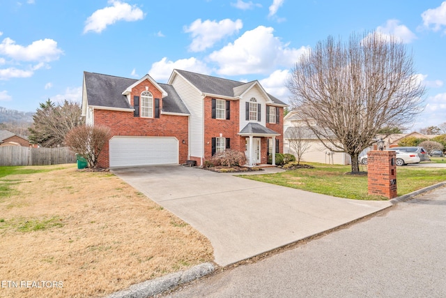 view of front of house with a front lawn and a garage