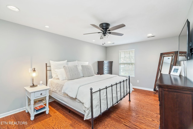 bedroom with hardwood / wood-style flooring and ceiling fan