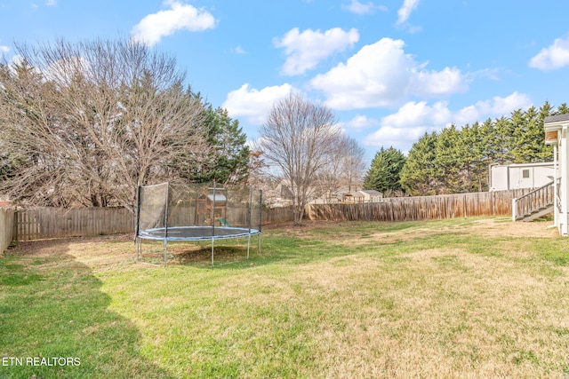 view of yard featuring a trampoline