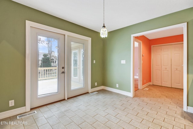 entryway featuring french doors