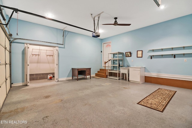 garage with ceiling fan and a garage door opener