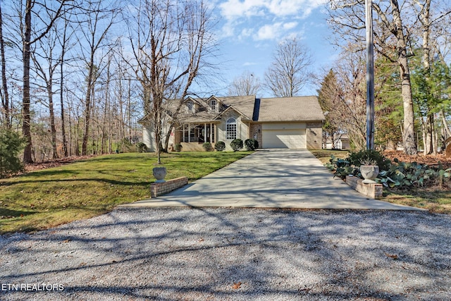 view of front of home with a garage and a front lawn