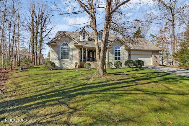 view of front of property with a garage and a front lawn