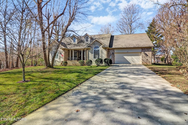 view of front of property with a garage and a front yard