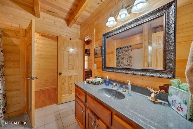 bathroom featuring tile patterned flooring, beam ceiling, wooden walls, and wooden ceiling