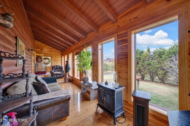 sunroom with vaulted ceiling with beams and wooden ceiling