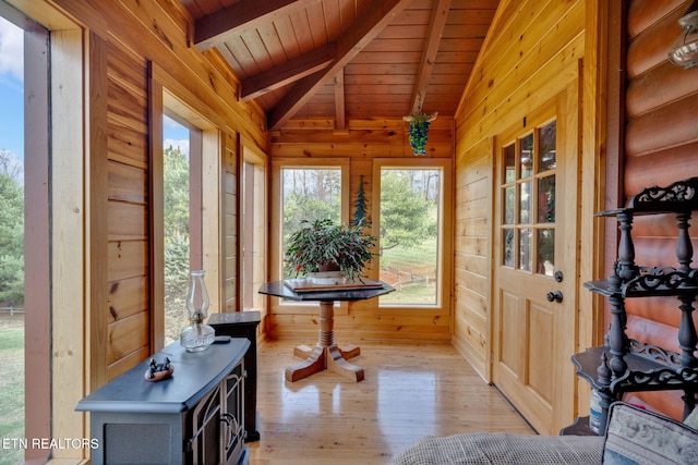 sunroom featuring vaulted ceiling with beams and wood ceiling