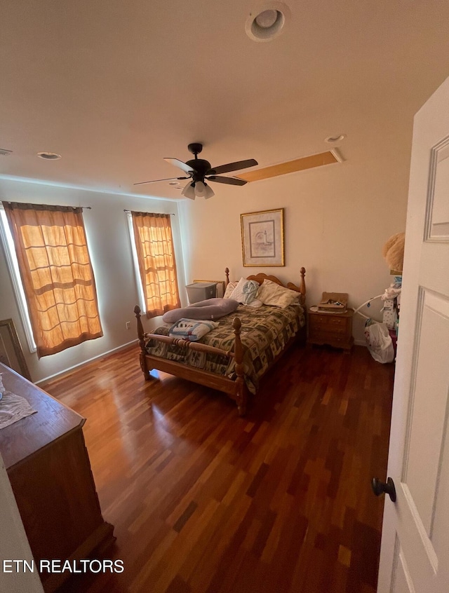 bedroom featuring ceiling fan and dark hardwood / wood-style flooring