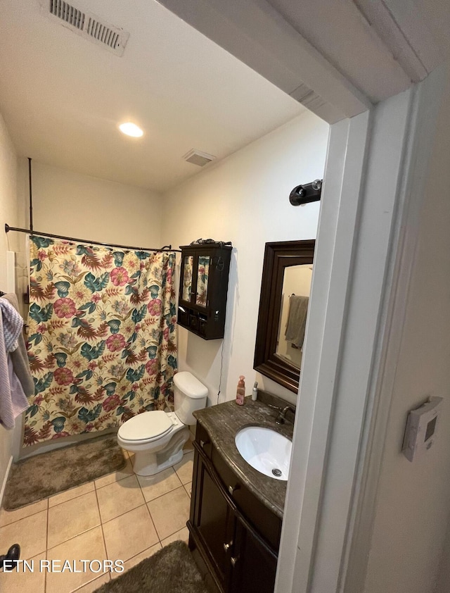 bathroom with tile patterned floors, vanity, toilet, and a shower with shower curtain