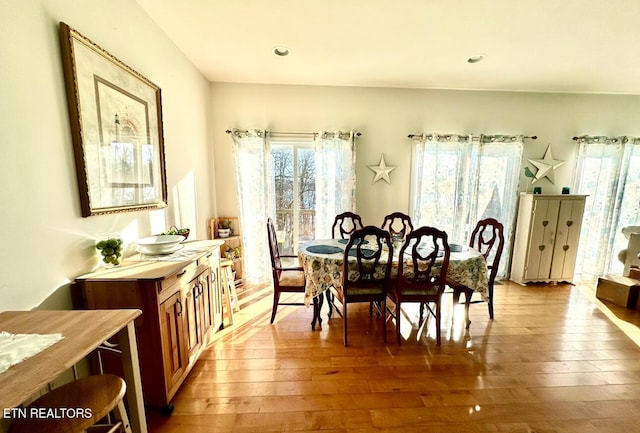 dining area with hardwood / wood-style flooring