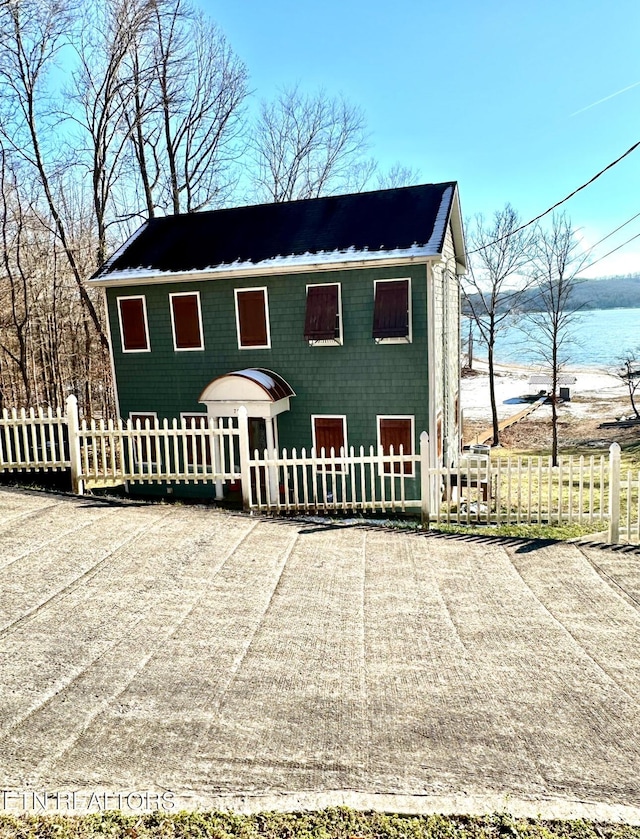 view of front of house featuring a water view