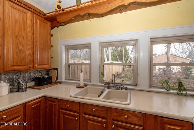 kitchen with tasteful backsplash and sink