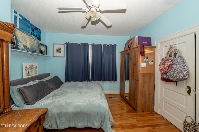 bedroom featuring ceiling fan and wood-type flooring