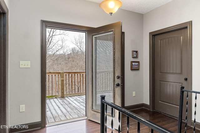 doorway to outside featuring dark hardwood / wood-style floors