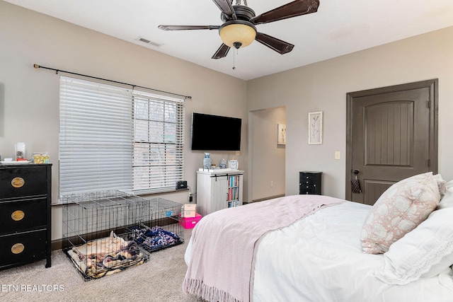 bedroom with ceiling fan and light colored carpet