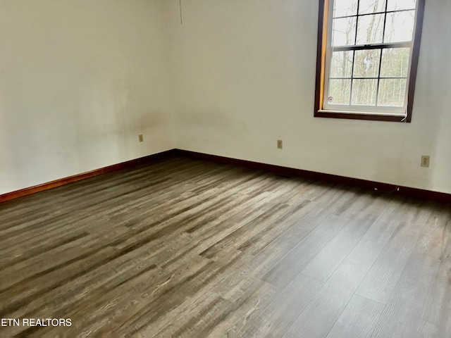 unfurnished room featuring wood-type flooring