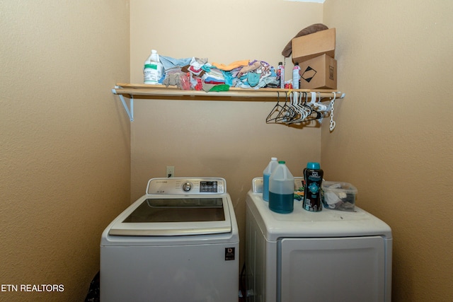 laundry room with independent washer and dryer