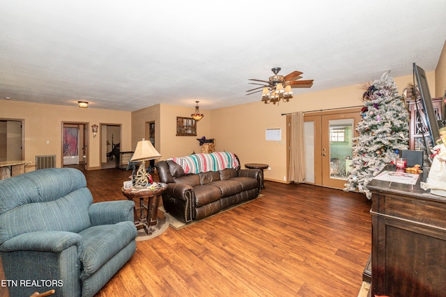 living room with hardwood / wood-style flooring, ceiling fan, and french doors