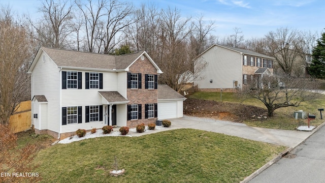 view of front of property featuring a front lawn and a garage