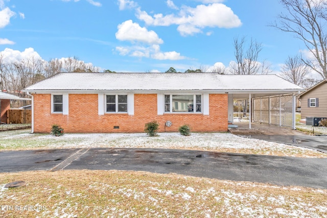 ranch-style home with a carport