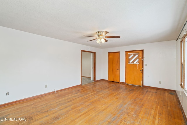 unfurnished bedroom with ceiling fan, light hardwood / wood-style flooring, and a textured ceiling