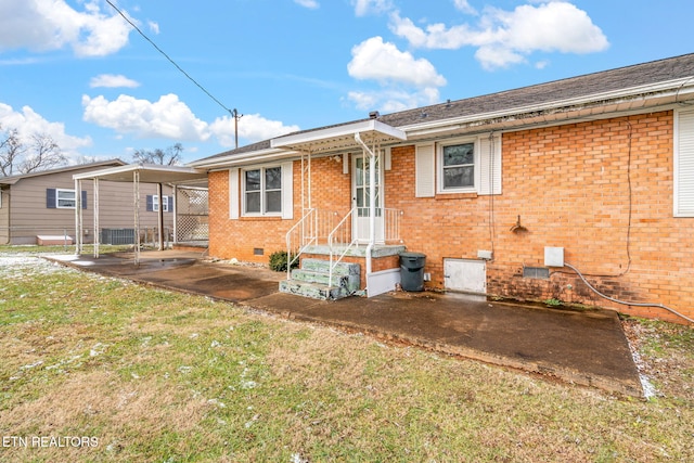 rear view of property featuring a yard