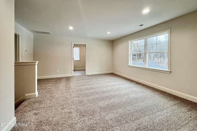 spare room with carpet floors