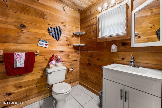 bathroom featuring wood ceiling, tile patterned floors, vanity, wooden walls, and toilet