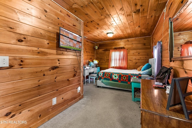 carpeted bedroom featuring wood ceiling and wooden walls